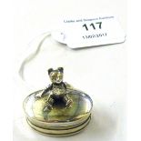 A modern silver pill box mounted with a Teddy bear