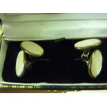 A pair of silver and mother of pearl cufflinks