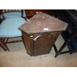 A walnut veneered hanging corner cupboard