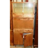 A 1960/70's kitchen cabinet with sliding glass doo