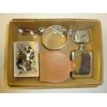 A box containing a small hip flask; a time piece;