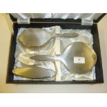 A silver three piece dressing table set