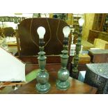 A pair of Eastern metal table lamps together with