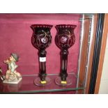 A pair of ruby glass lustres