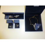 Four items of Swarovski costume jewellery