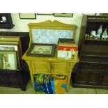 A stripped pine and tiled back wash stand