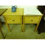 A pair of oak bedside tables, each fitted single d