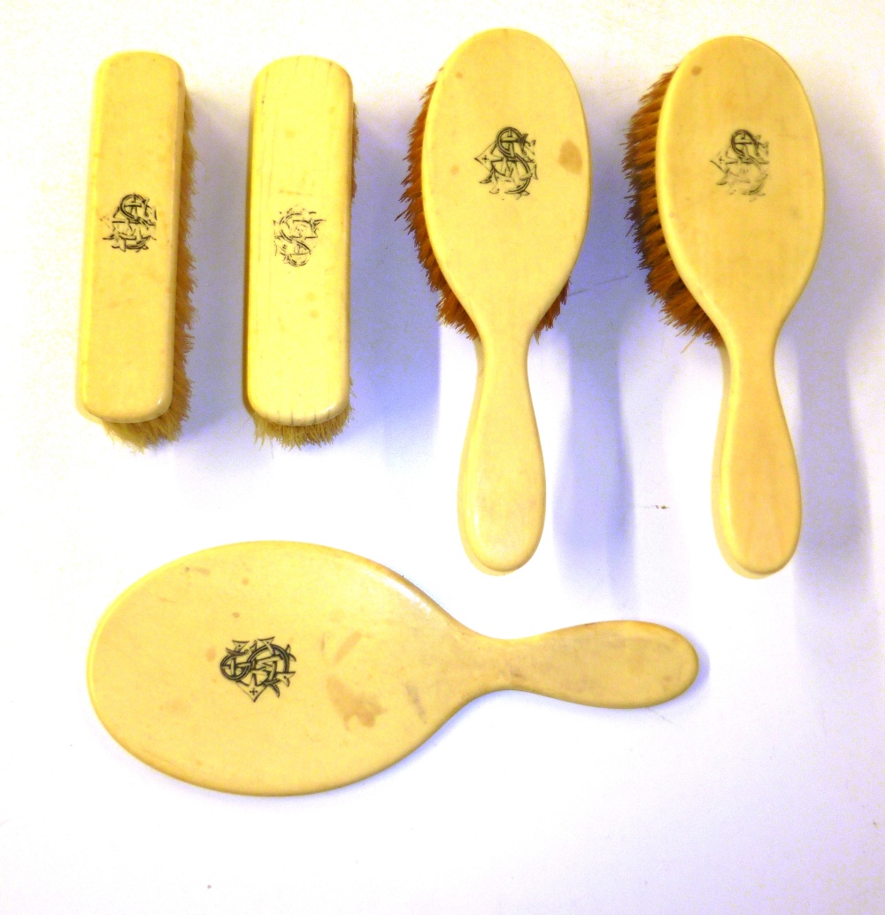 A box of ivory dressing table items