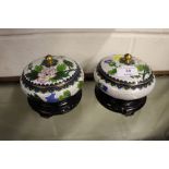 A pair of Chinese cloisonné pots and covers on sta