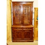 A Victorian mahogany bookcase raised on two drawer