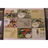 A box of cigarette cards and albums