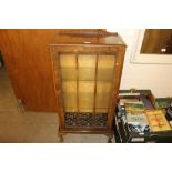 A walnut and glazed display cabinet