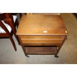 An oak sewing trolley