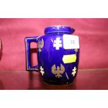 A Royal blue jug decorated with 'The Joan Of Arc'