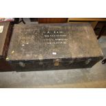 A large metal travelling trunk