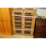 A Victorian pine and glazed cabinet