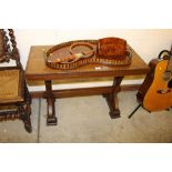 An Art Deco style oak stretcher table