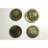 Four £5 coins