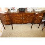 A reproduction mahogany extending dining table wit