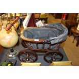 A Victorian style doll's pram