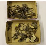 Two trays of keys and a tray of brass fittings; a