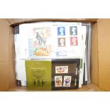 A box of Great British first day covers and presen