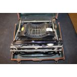 An early 20th Century Bijou portable typewriter in