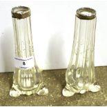 A pair of silver topped and glass vases