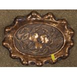 An Arts & Crafts copper embossed jardinière; and s