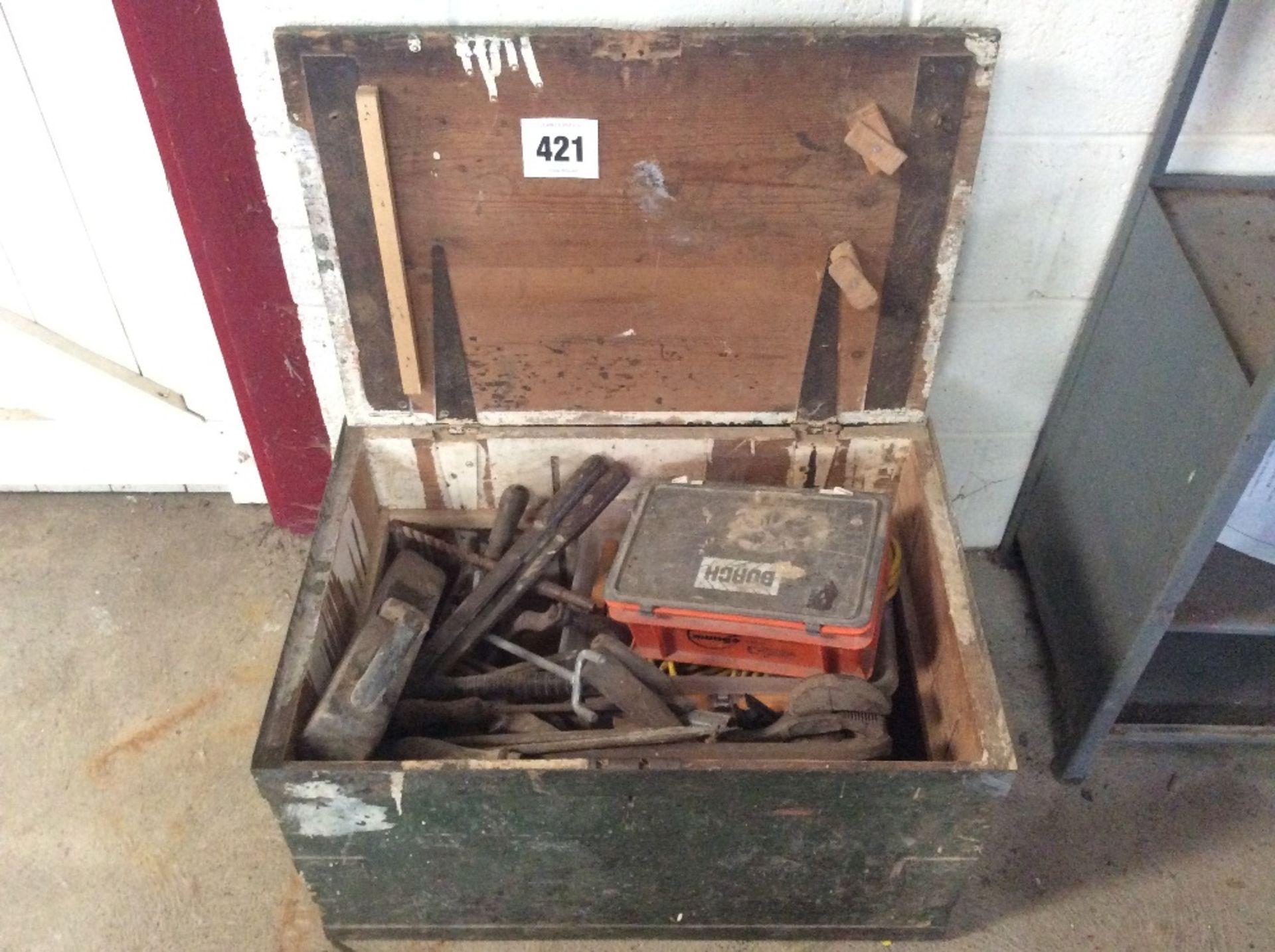 Wooden chest containing various tools