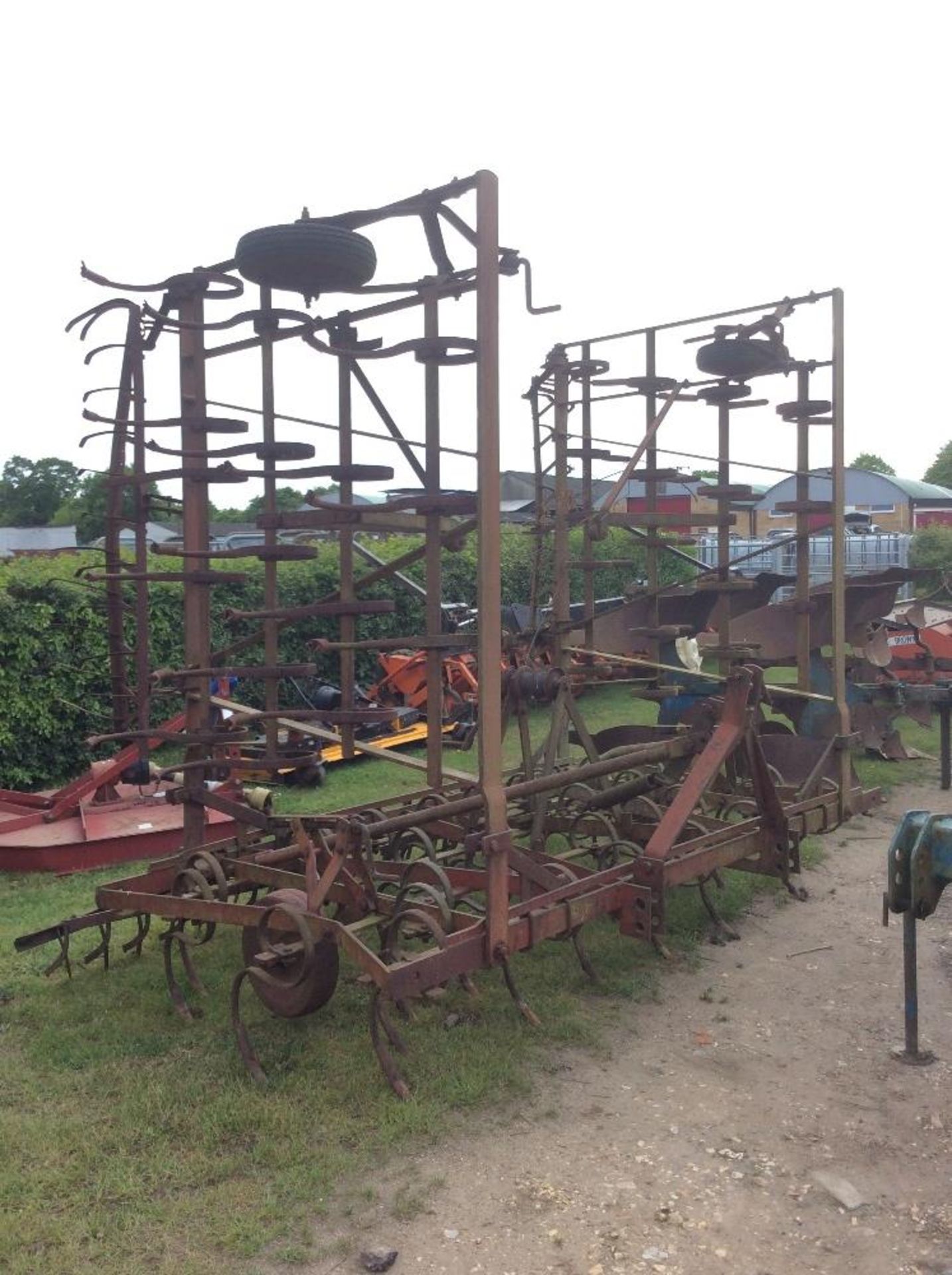 Kongskilde 24ft folding spring tines. With following harrow.