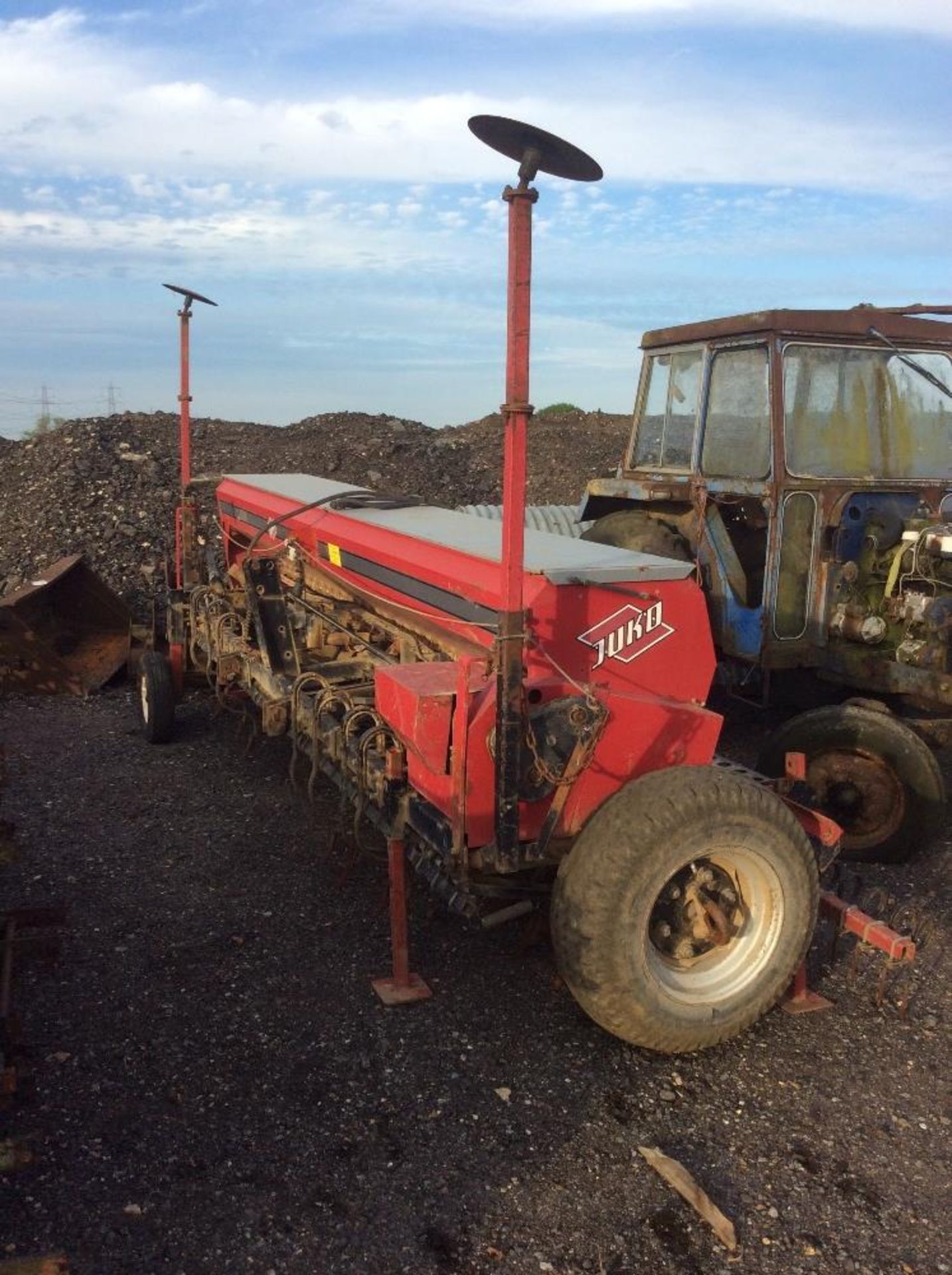 Juko 4M box drill. S/N 1010. With spring tine coulters, end tow, bout markers, covering harrow and