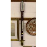 A mahogany cased ships stick barometer and thermom