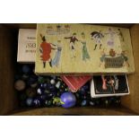 A 19th Century box containing glass marbles, playi