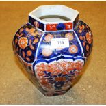 A pair of Japanese Imari vases, one lacking lid