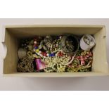 A wooden tray of costume jewellery