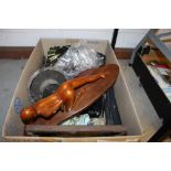 A box containing a carved wooden figure; a Carniva