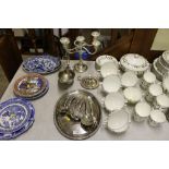 A quantity of silver plated ware to include a cand