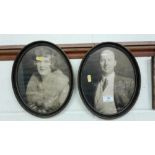 A pair of oval framed black and white photographs,