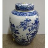 A large blue and white Oriental vase and cover