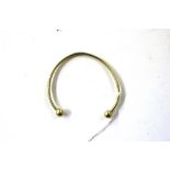 A 9ct gold bangle