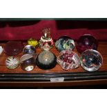 A collection of various Art Glass paperweights