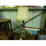 A large silvered table lamp and shade decorated wi