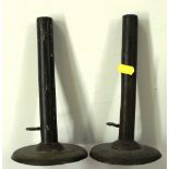 A pair of metal candlesticks