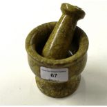 A stoneware pestle and morter