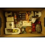 A box containing doll's house items and a table li