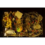 A jewellery box containing bead necklaces; wrist w