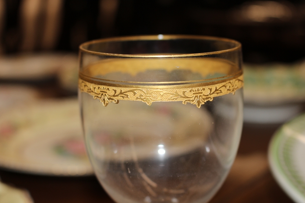 A part suite of mid 20th Century glassware, with gold leaf banded decoration, comprising 2 decanters - Image 4 of 5