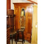 An Edwardian mahogany and inlaid single door wardr