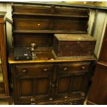 A dark Ercol dresser fitted two drawers